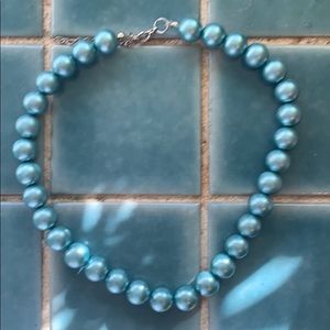 Light teal colored costume jewelry pearl necklace